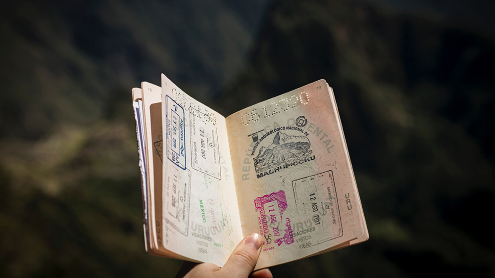 An open passport with stamps